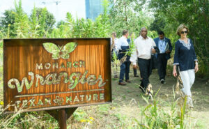 Mrs. Laura Bush walking through the native Texas park with friends.