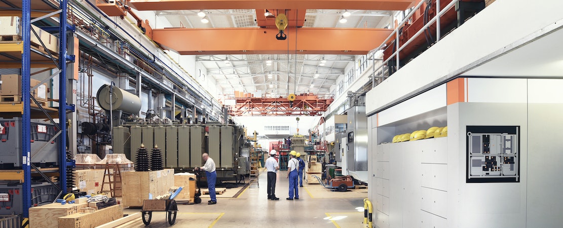 Peopel workign ion a manufacturing plant.