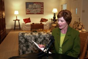 Mrs. Laura Bush tapes the Weekly Radio Address in Crawford, Texas to kick off a "world-wide effort to focus on the brutality against women and children by the Al Qaeda terrorist network and the regime it supports in Afghanistan." Photo by Susan Sterner, Courtesy of the George W. Bush Presidential Library.