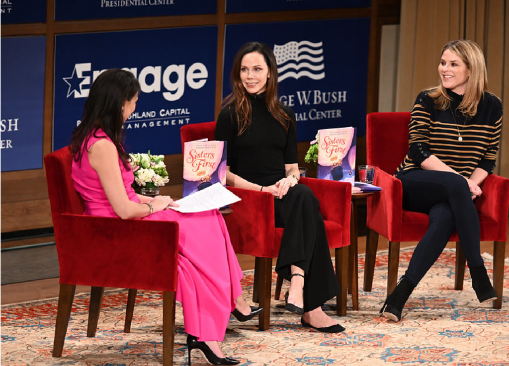 Barbara Bush being interviewed with her sister Jenna on stage.