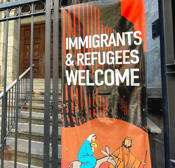 Sign saying Immigrants and Refugees Welcome