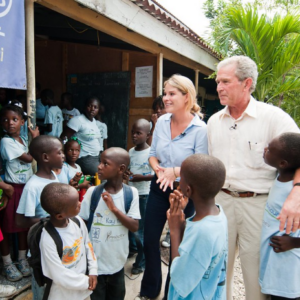 Jenn Hager and President Bush at a UNICEF location.
